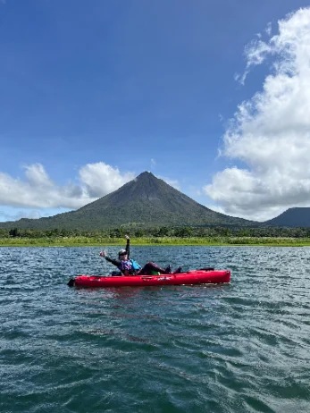 Wide — boat on the lake, volcano
